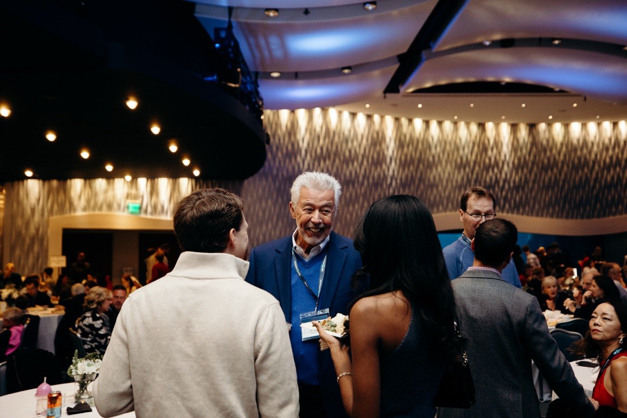 Guests mingling under string lights
