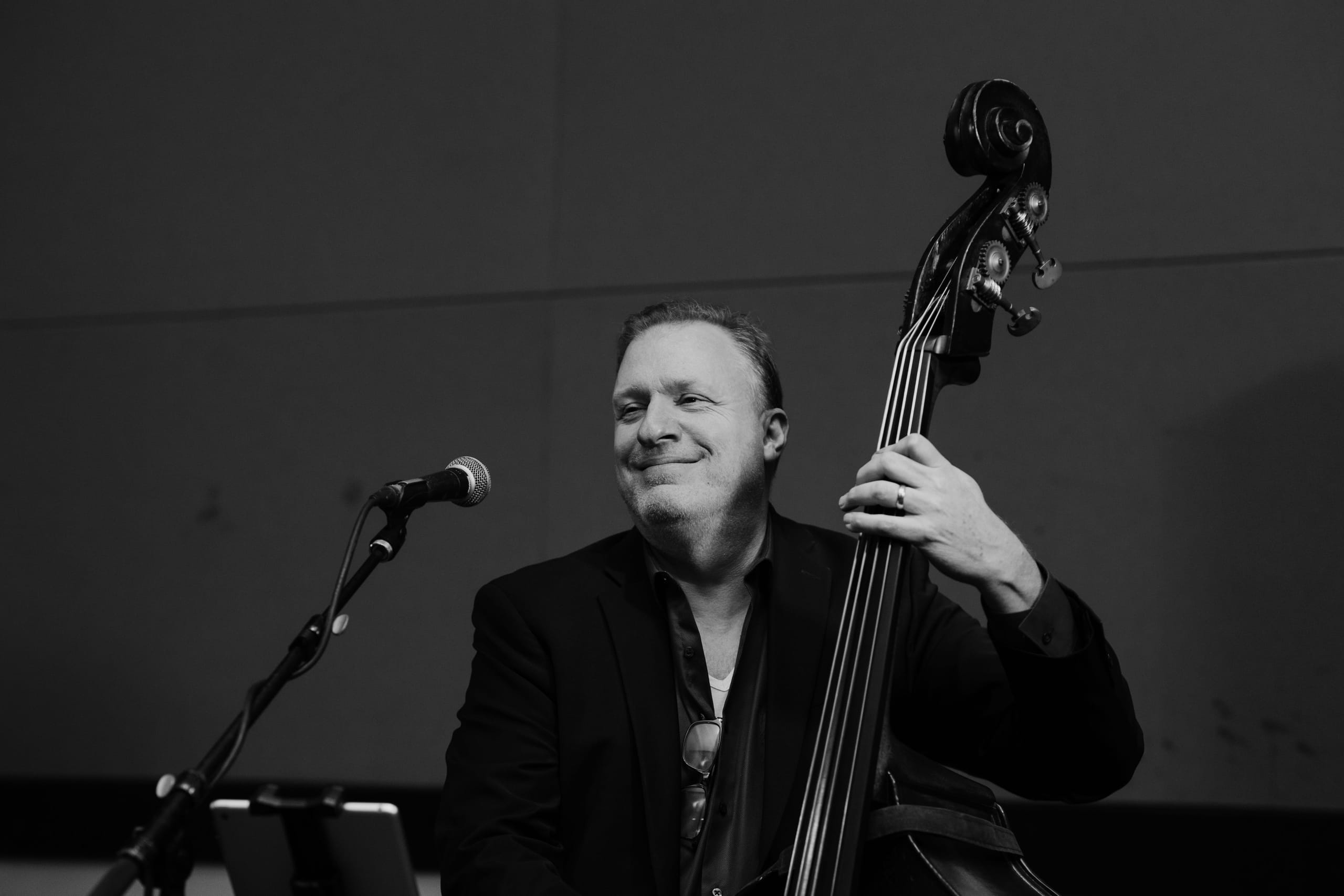 Upright bass player performing at a company event