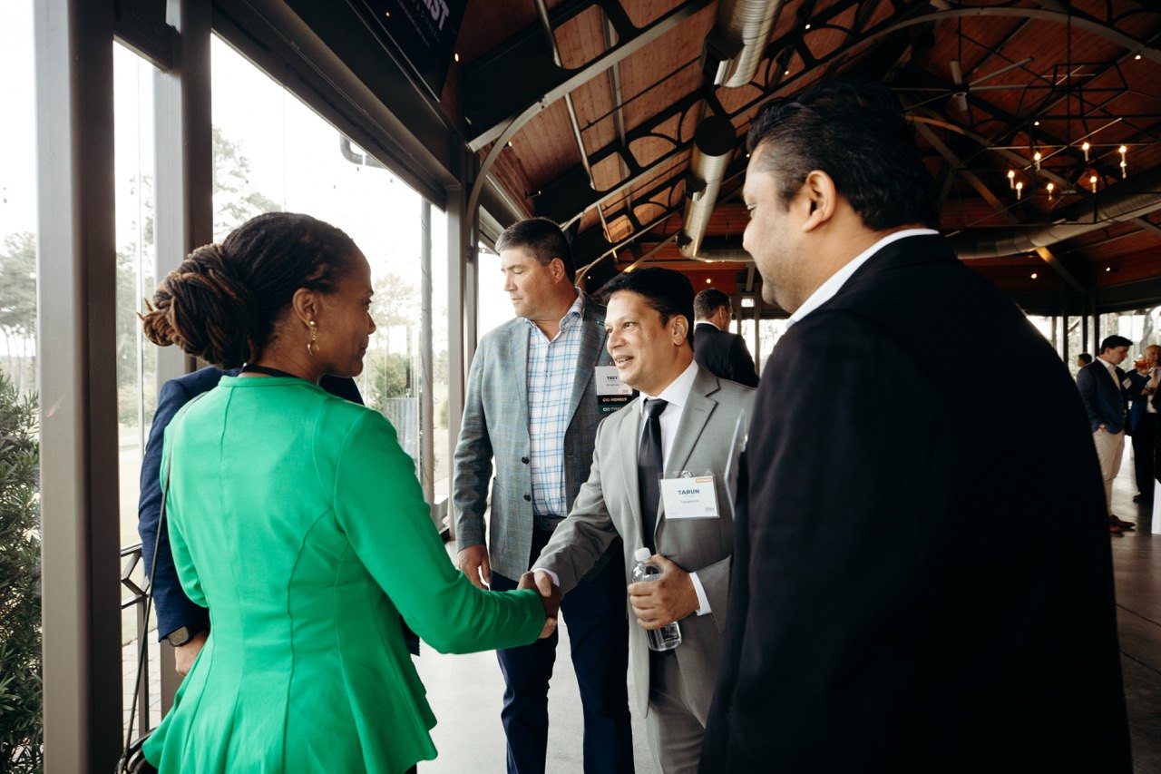 Guests shaking hands at a pavilion reception