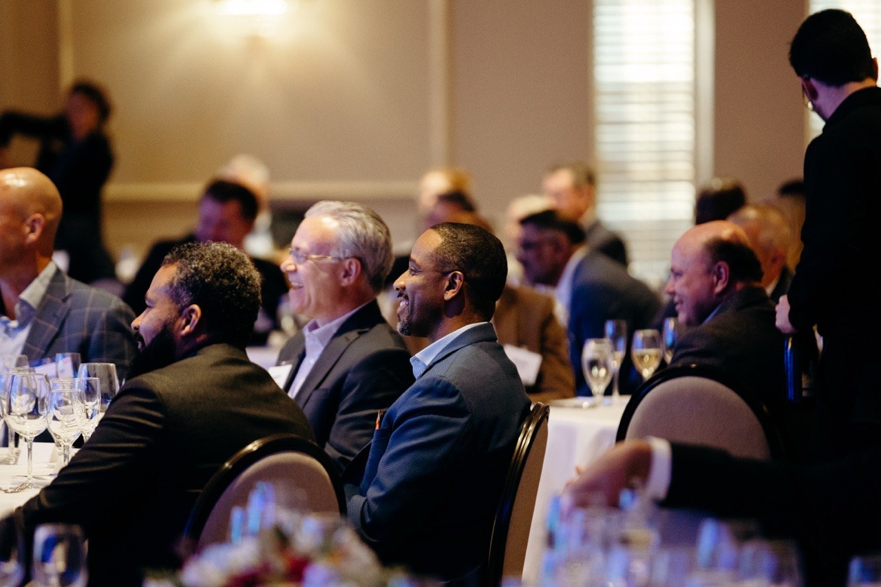 Guests seated at a banquet during a program